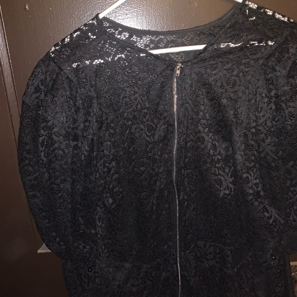Lightly worn peplum shirt